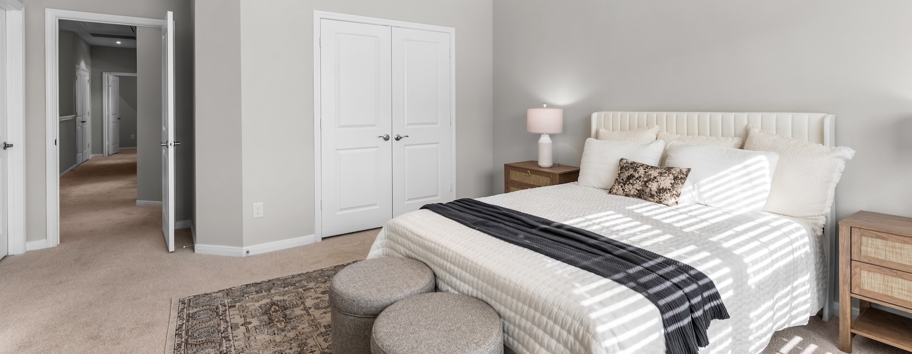 a bedroom with a bed and two nightstands