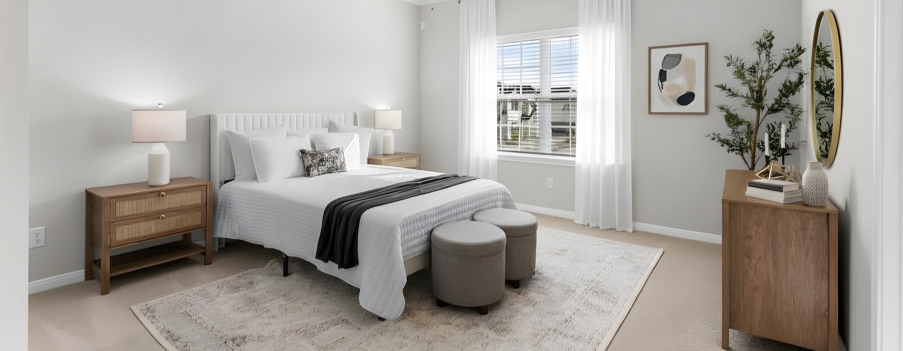 a bedroom with a bed and a fan